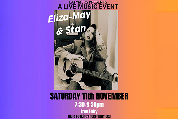 Eliza-May and Stan Jarvis Siting with Acoustic Guitar